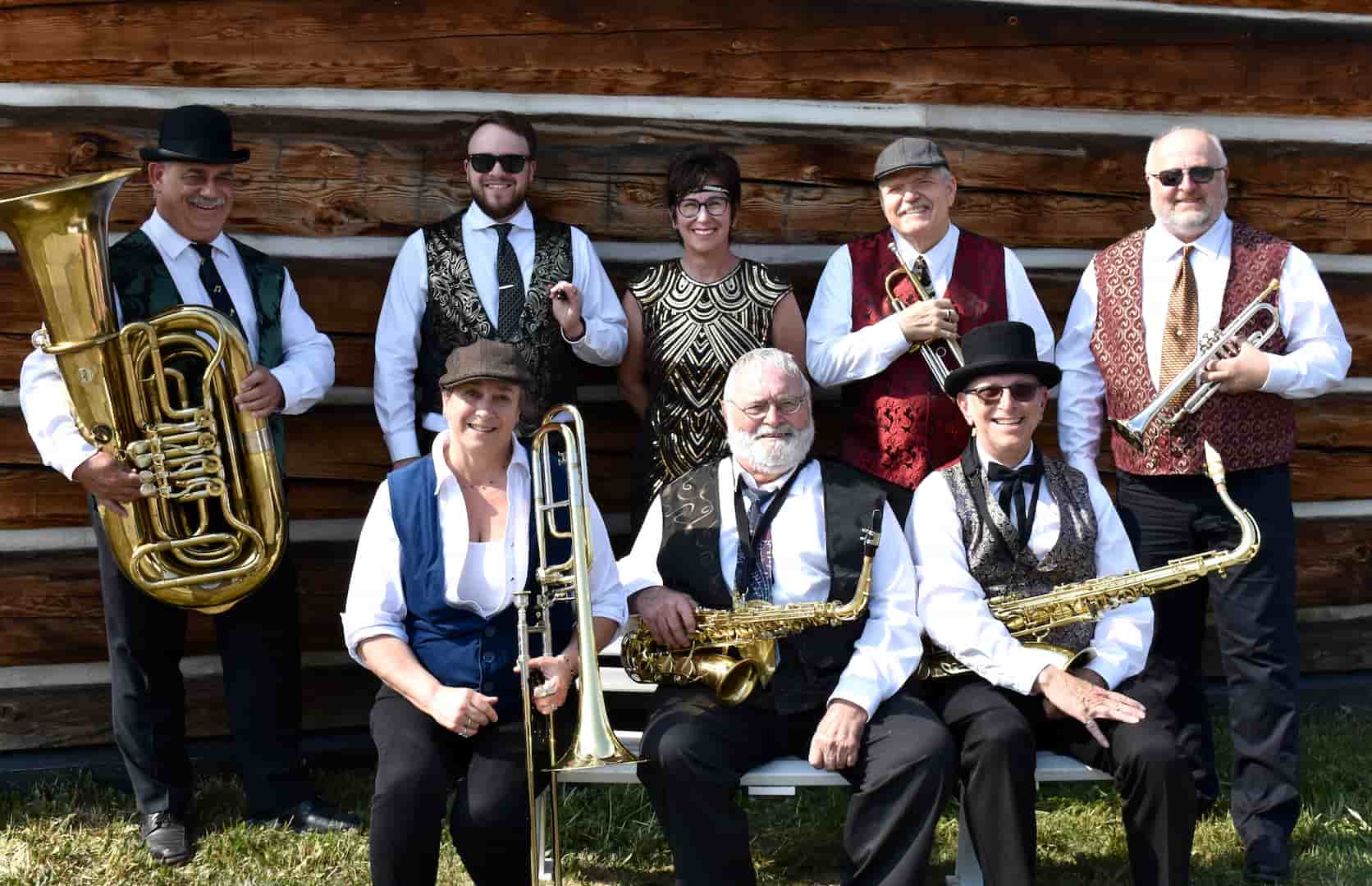Group photo of Panache in front of old wood building