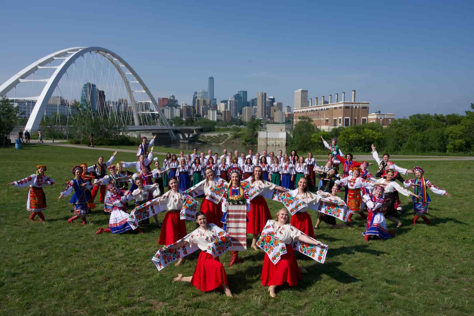 Viter Ukrainian dancers group posing in front of Walterdale Bridge in Edmonton