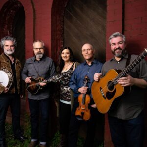 John Reischman and band posing with their instruments