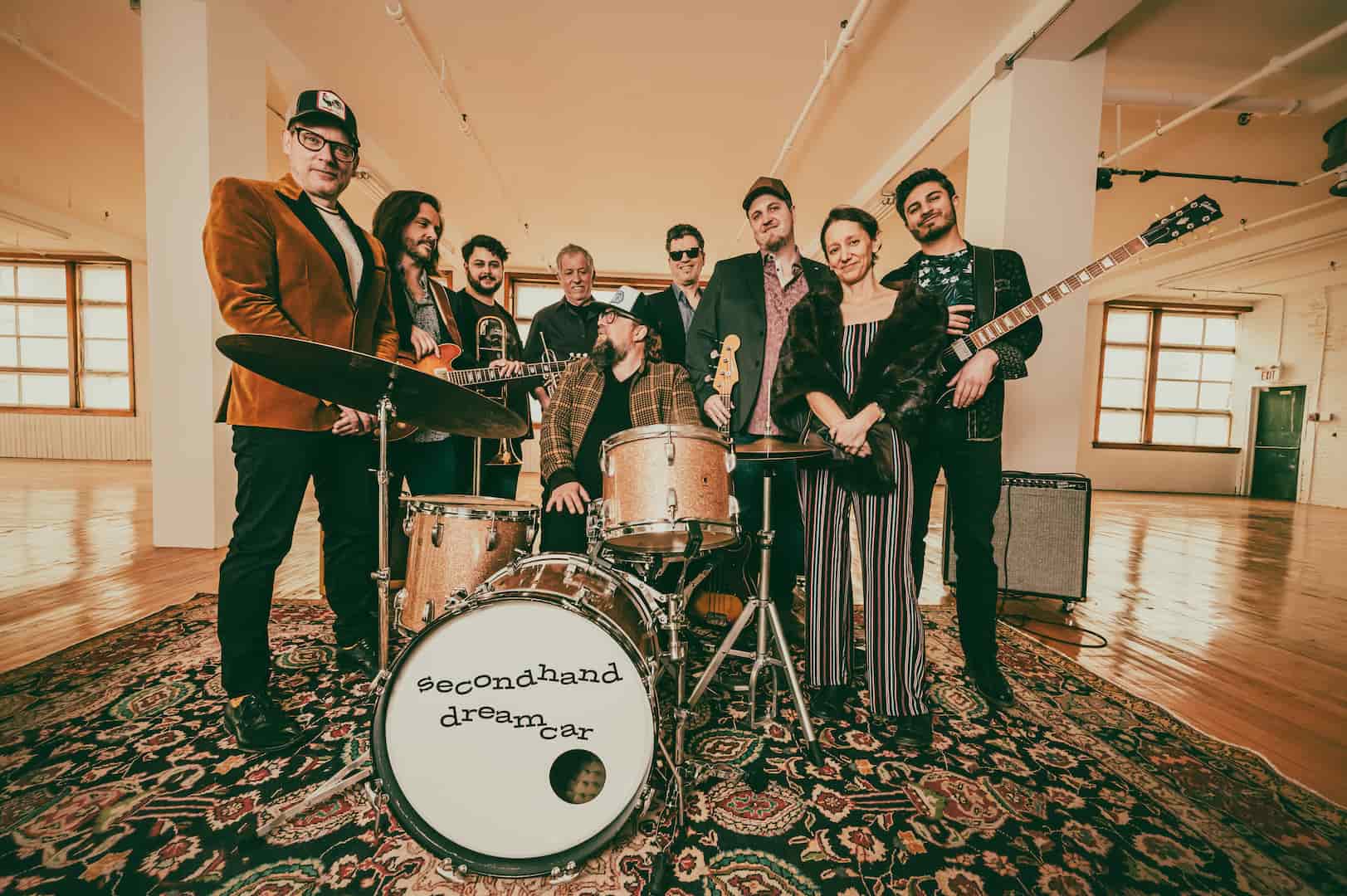 Group photo of Secondhand Dreamcar in empty building loft room